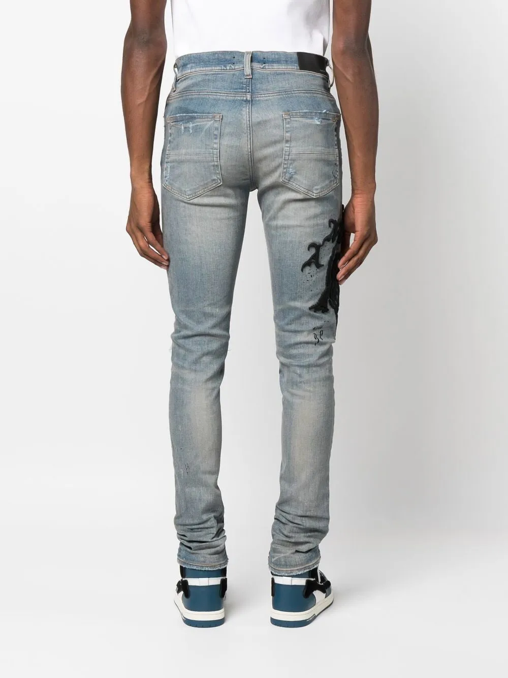 AMIRI logo-embroidered skinny jeans