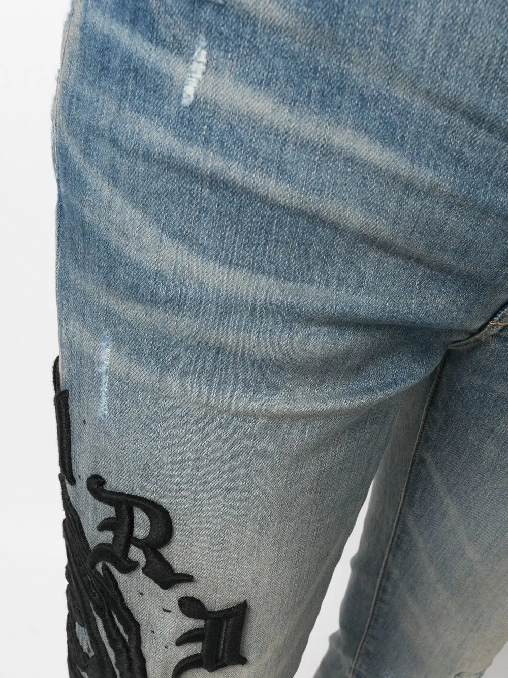AMIRI logo-embroidered skinny jeans