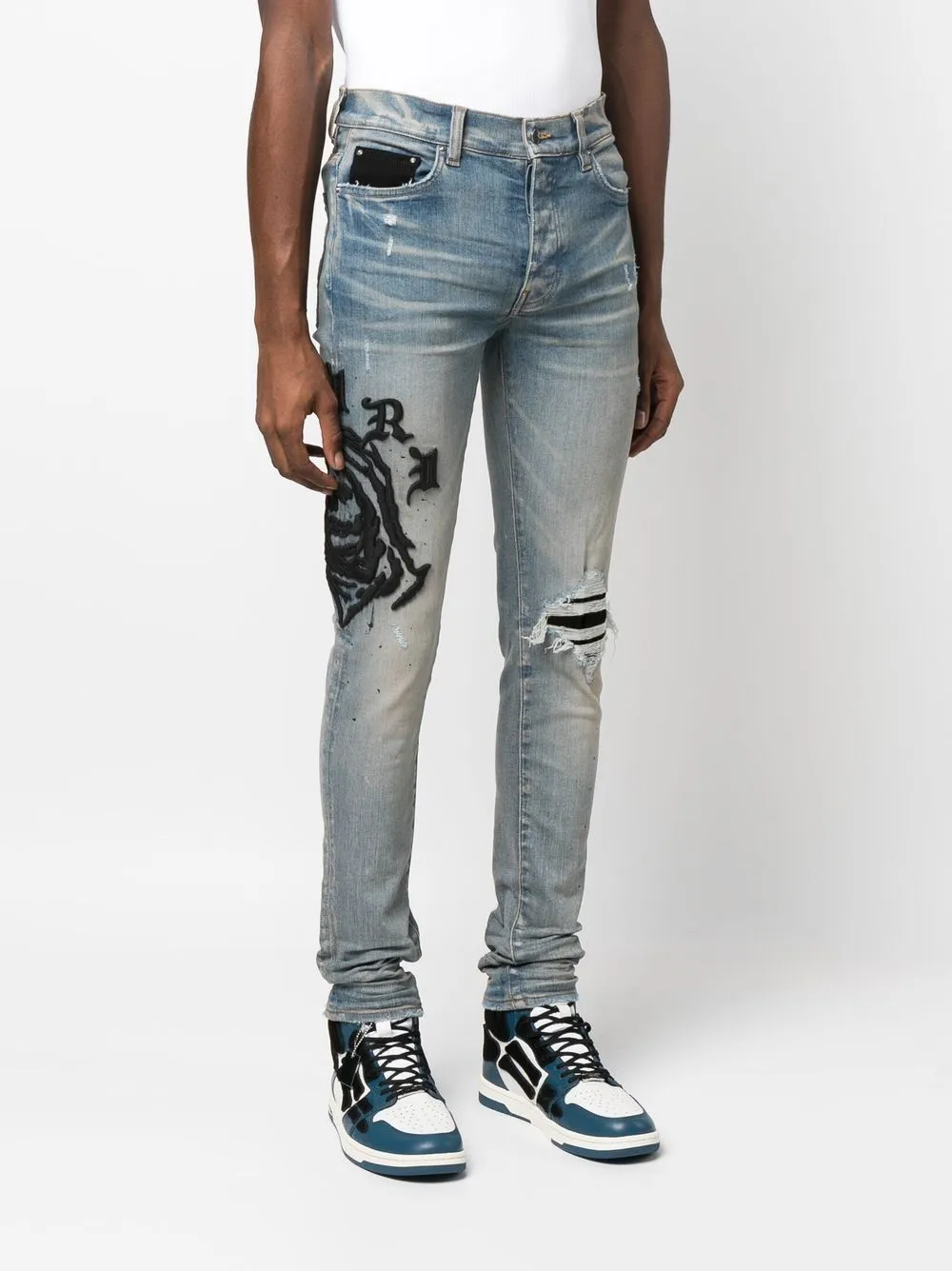 AMIRI logo-embroidered skinny jeans