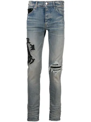 AMIRI logo-embroidered skinny jeans