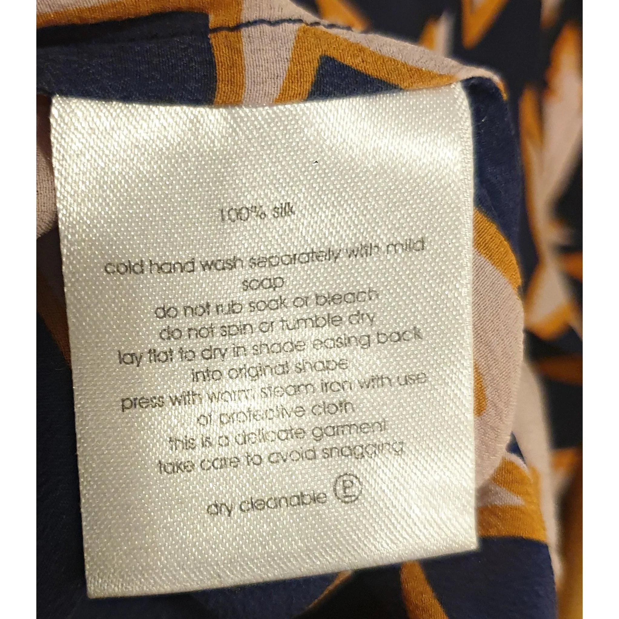 Gorman navy 100% silk skirt with pink and orange star print fits size 12