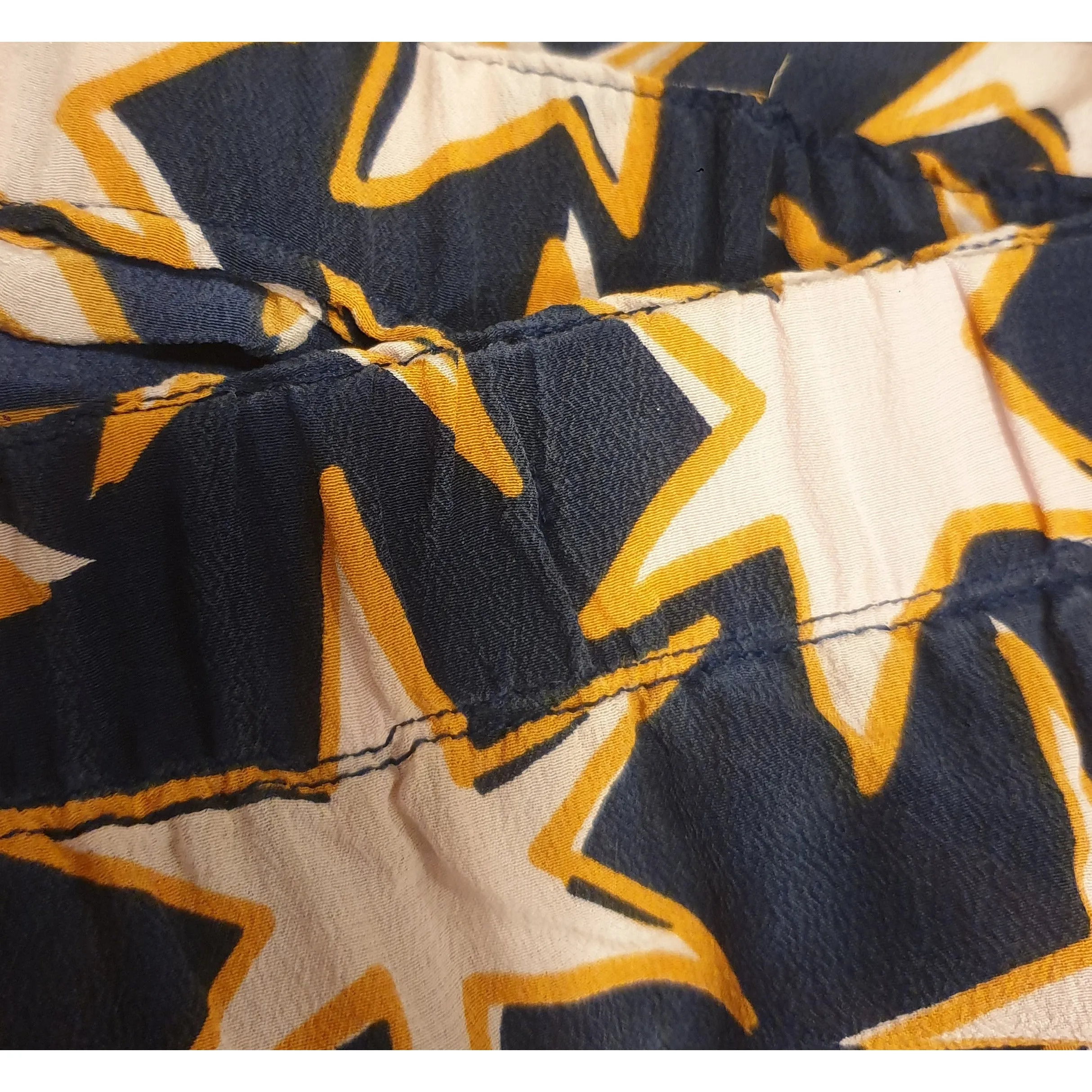 Gorman navy 100% silk skirt with pink and orange star print fits size 12